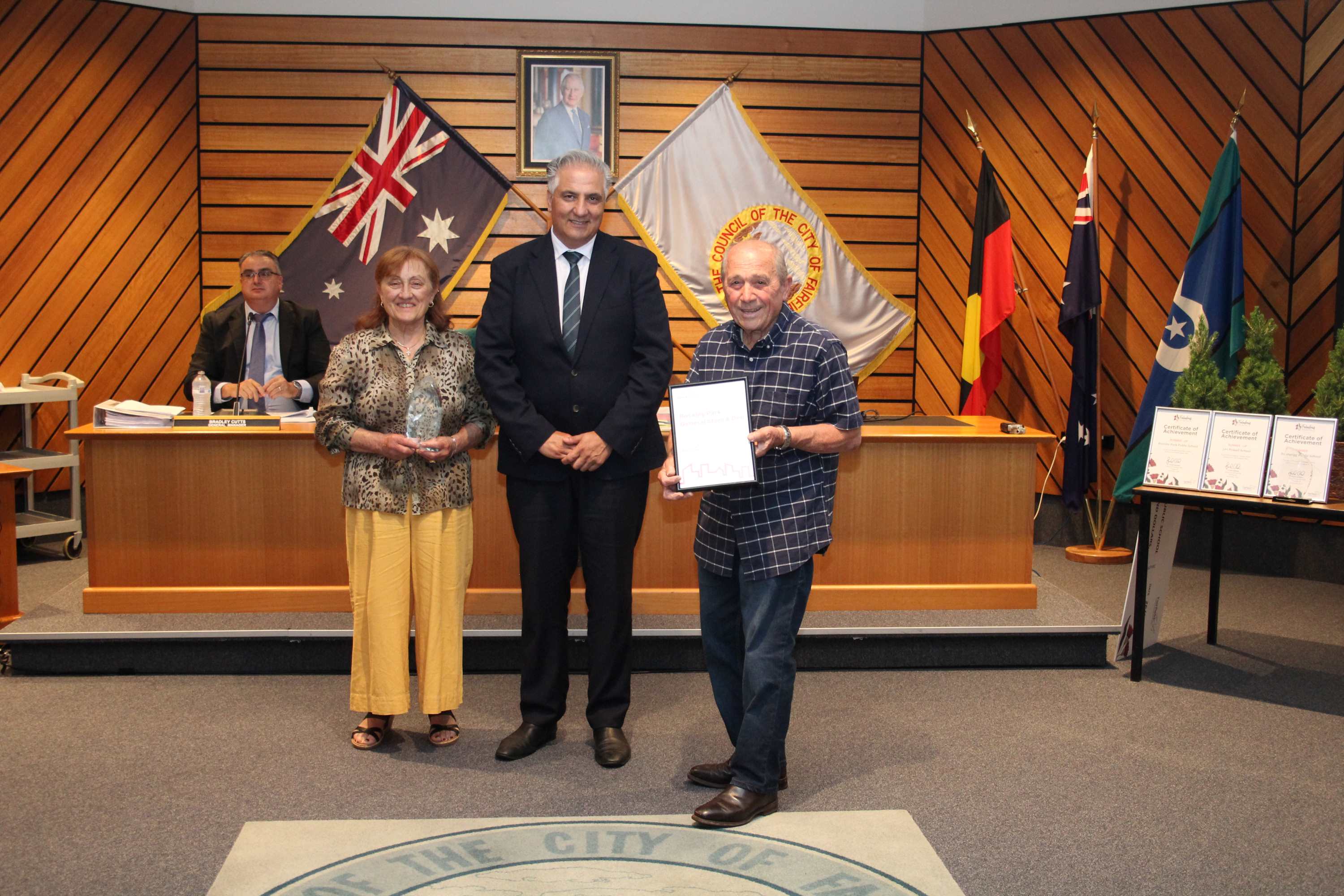 Group photo of Mayor Frank Carbone, Enzo and Franca Di Federico from Bossley Park General Store and Deli receiving the Fairfield City Lifetime Business Award on 26 November 2024.