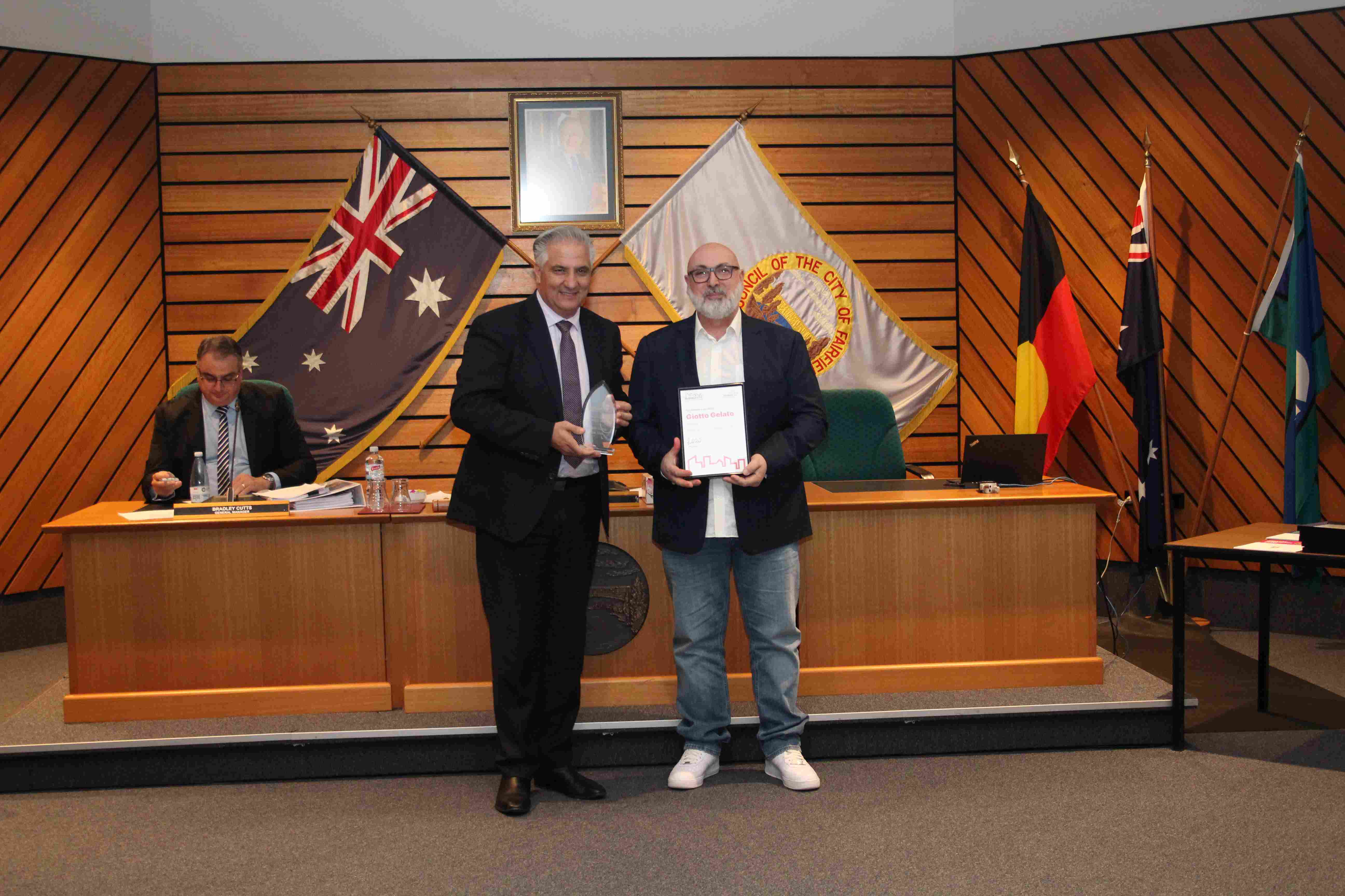 Group photo of Mayor Frank Carbone and Peter Giotto from Giotto Gelato receiving the Fairfield City Lifetime Business Award on 25 June 2024