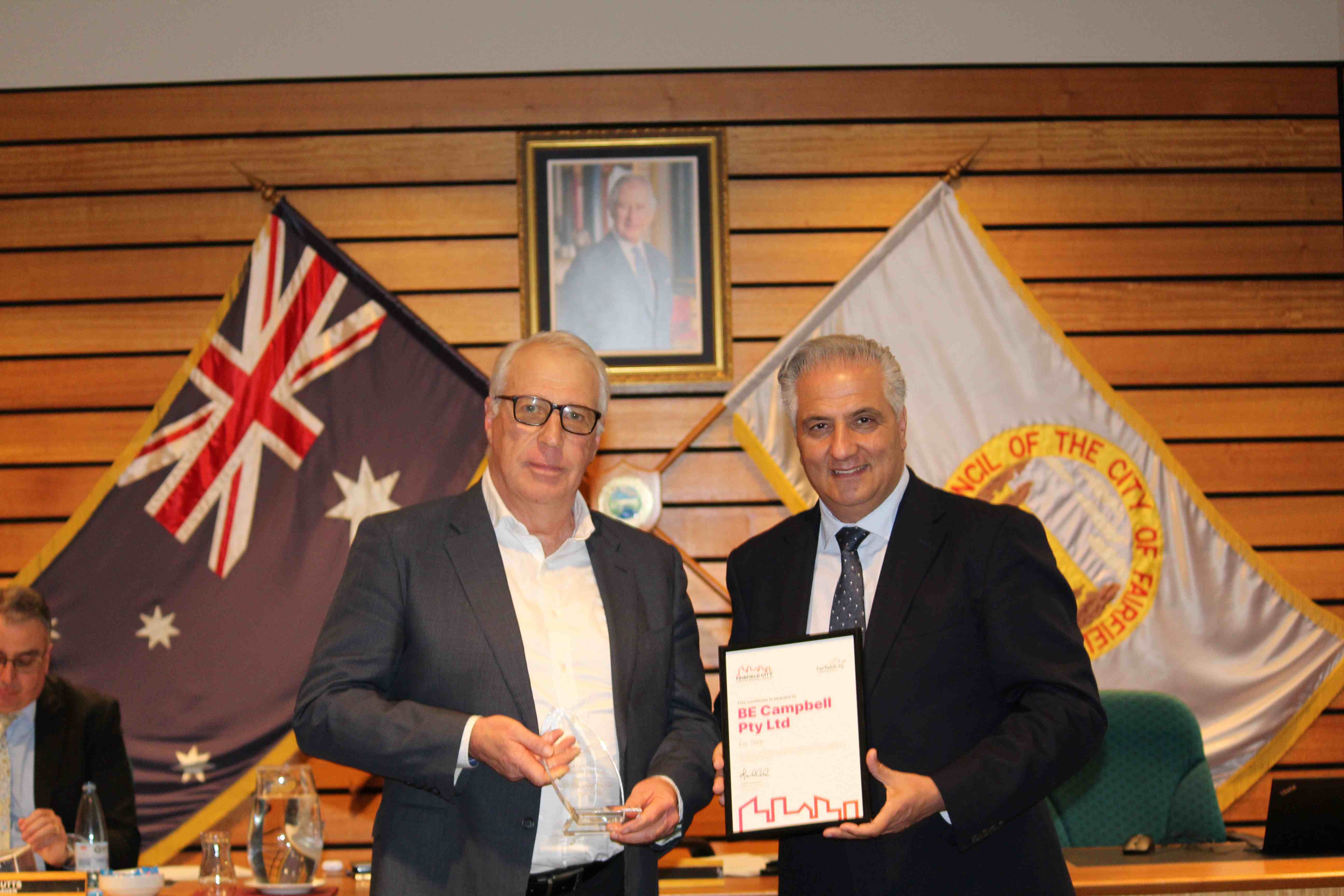 Group photo of Mayor Frank Carbone and Ted Campbell from BE Campbell receiving the Fairfield City Lifetime Business Award on 23 July 2024