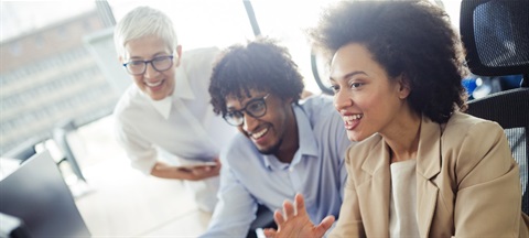 Corporate colleagues smiling.